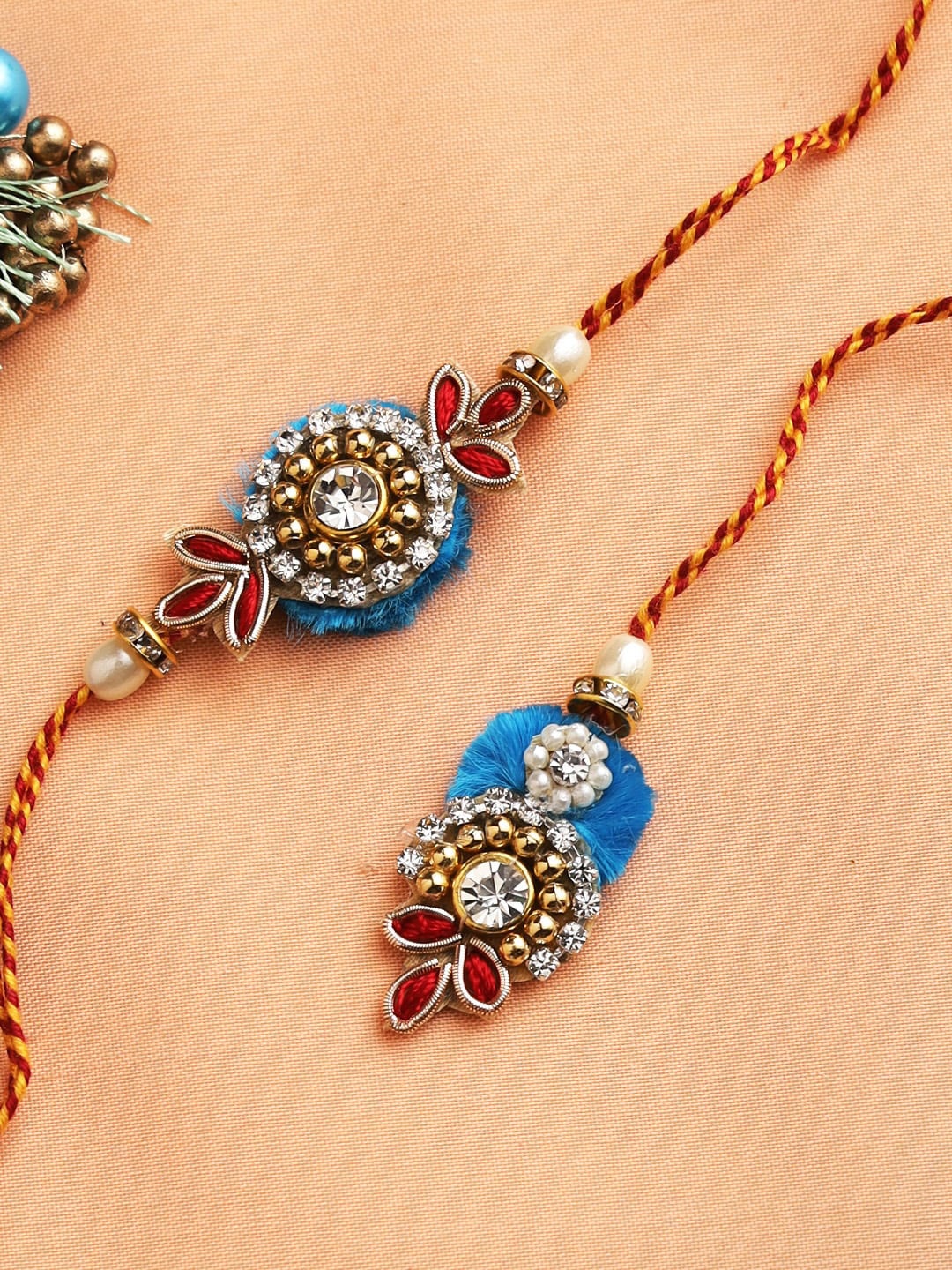 

Aapno Rajasthan Diamonds and Beads Embellished Bhaiya Bhabhi Rakhi Set, Blue