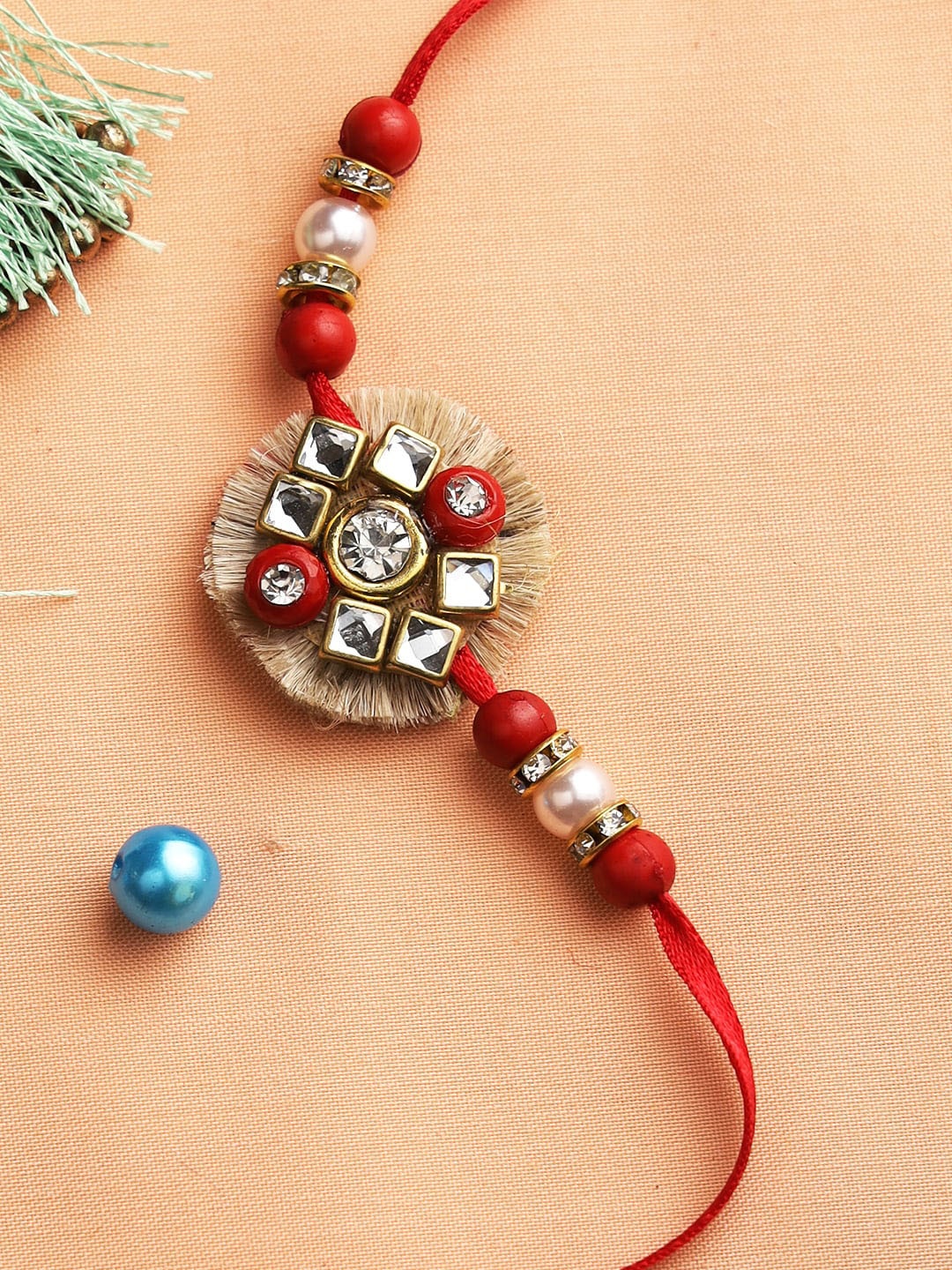 

Aapno Rajasthan Pack of 3 Multicoloured Rakhi with Roli Chawal Set, Multi