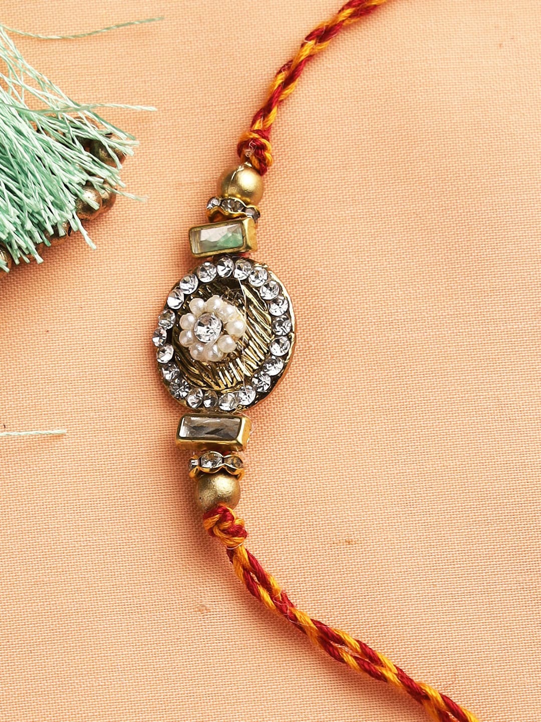 

Aapno Rajasthan Golden & White Stone & Beads Handcrafted Rakhi, Gold