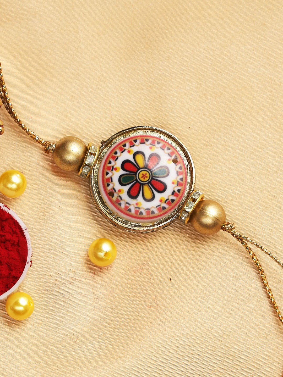 

Aapno Rajasthan Multicoloured Dome Shaped Rakhi, Multi