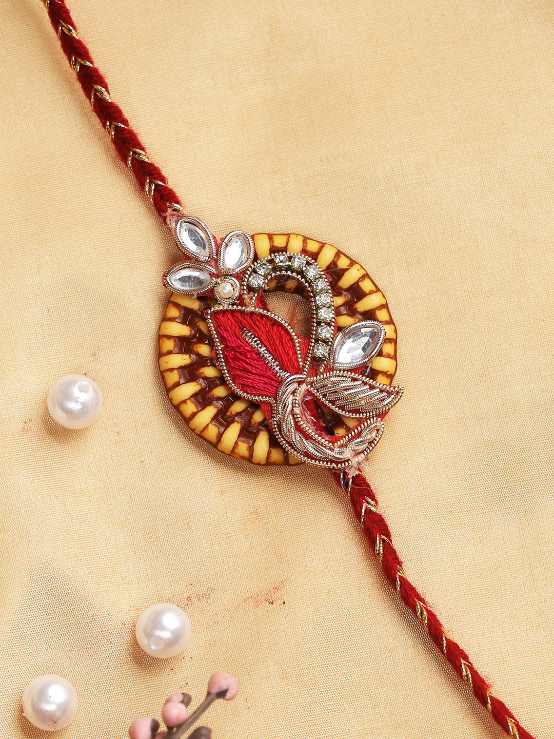 

Aapno Rajasthan Red & Yellow Traditional Beaded Floral Thread Rakhi