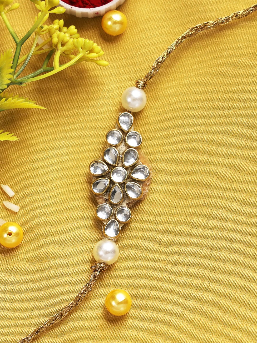 

Aapno Rajasthan Gold-Toned Kundan Embellished Rakhi
