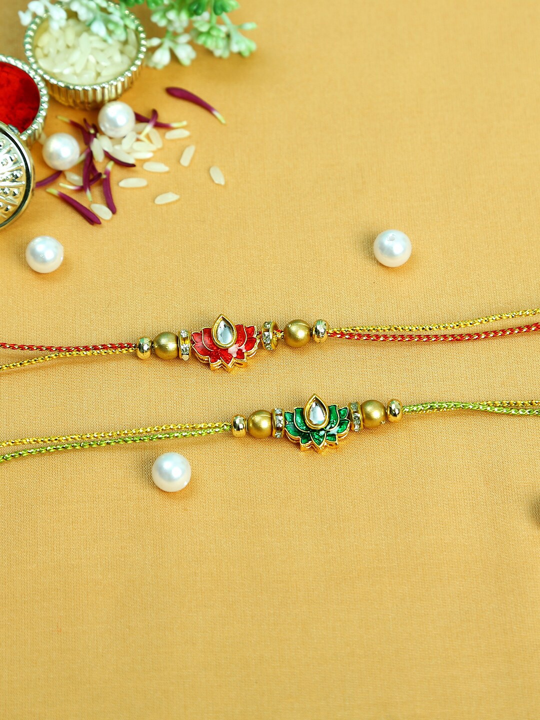 

Aapno Rajasthan 4 Pieces Lotus Shape Kundan Thread Rakhi Combo, Multi