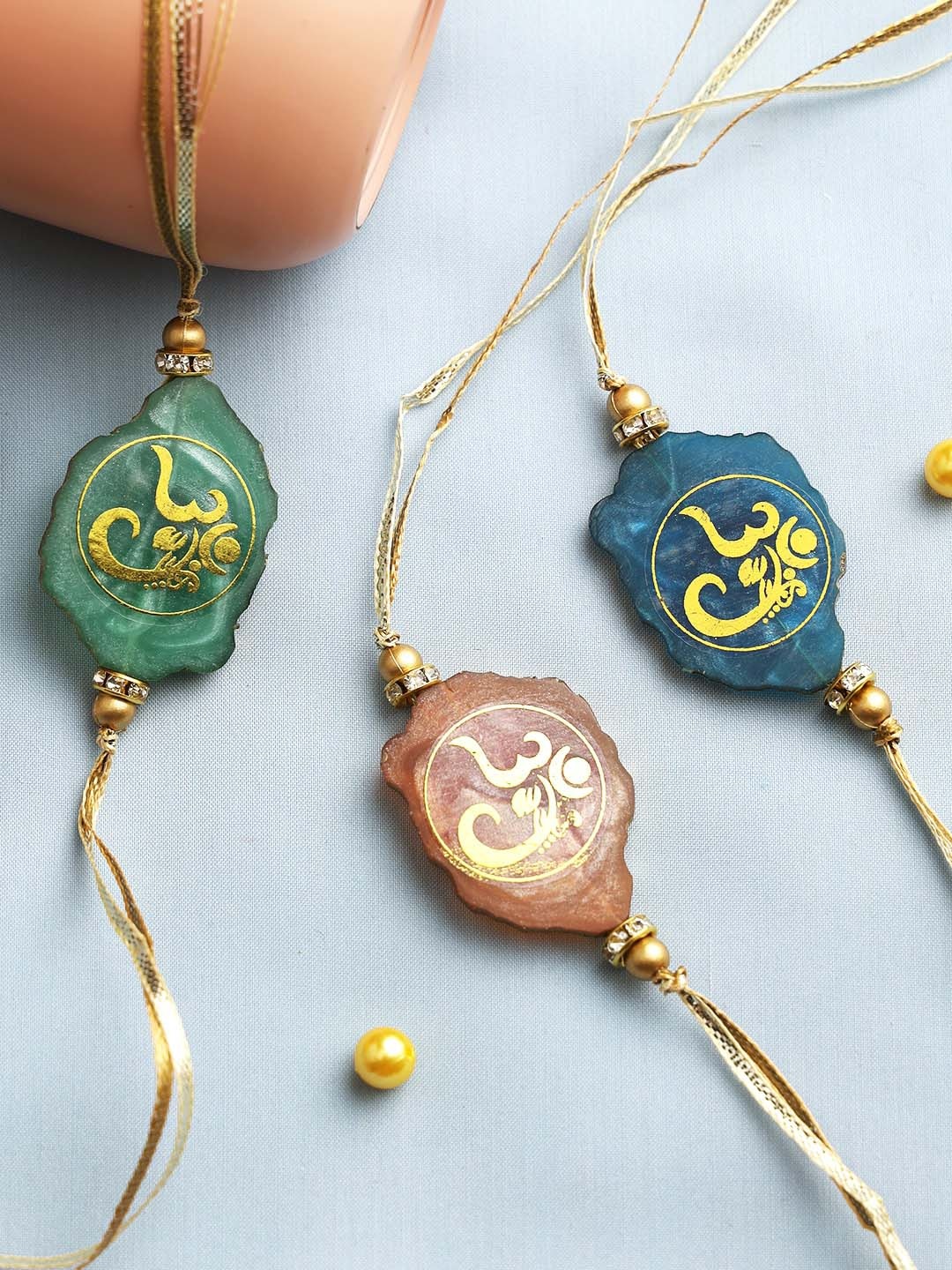

Aapno Rajasthan Set of 3 Divinely Stone Om Rakhis, Multi