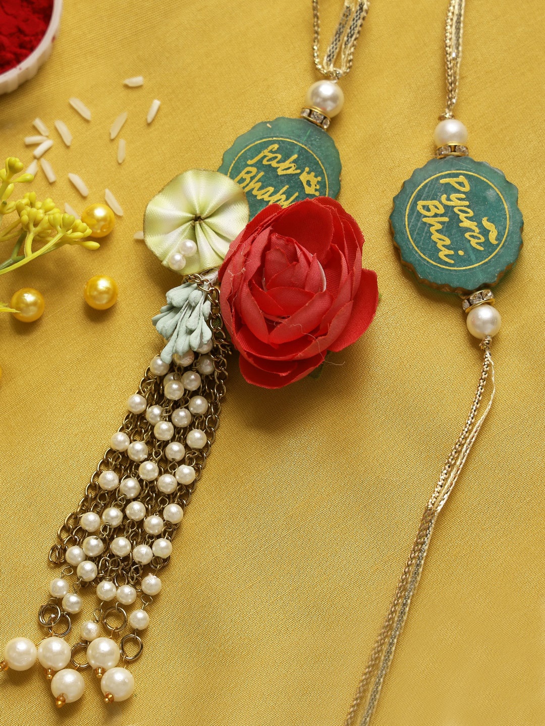 

Aapno Rajasthan 2 Pieces Green & White Pearl and Rose Beaded Bhaiya Bhabhi Rakhi Set