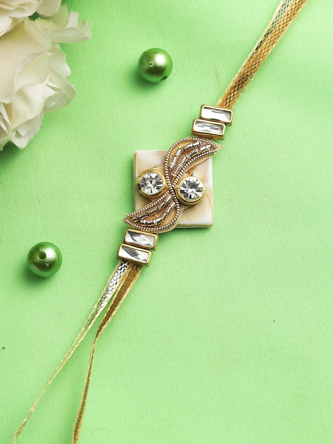 

Aapno Rajasthan Brown Designer Diamonds and Zardosii Work Rakhi