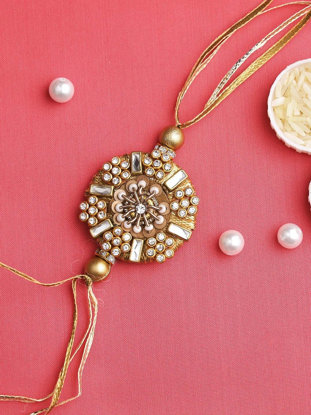 

Aapno Rajasthan Gold-toned Embellished Floral Rakhi