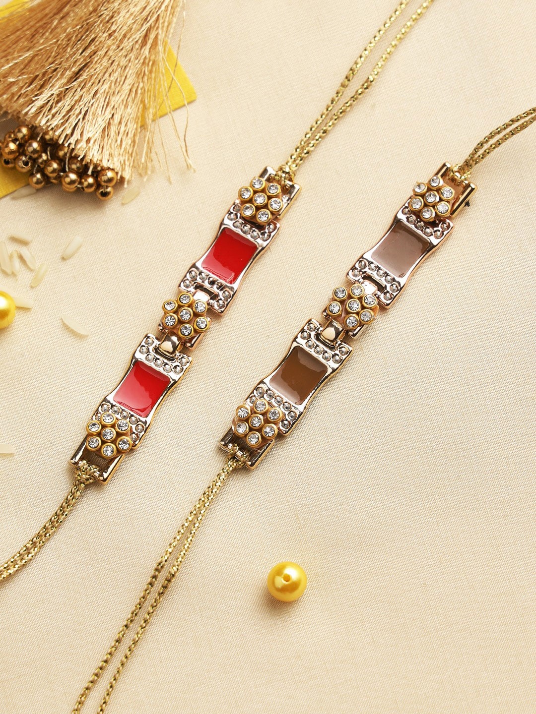 

Aapno Rajasthan Set Of 2 Red & Gold-Toned Flower Beaded & Studded Rakhis