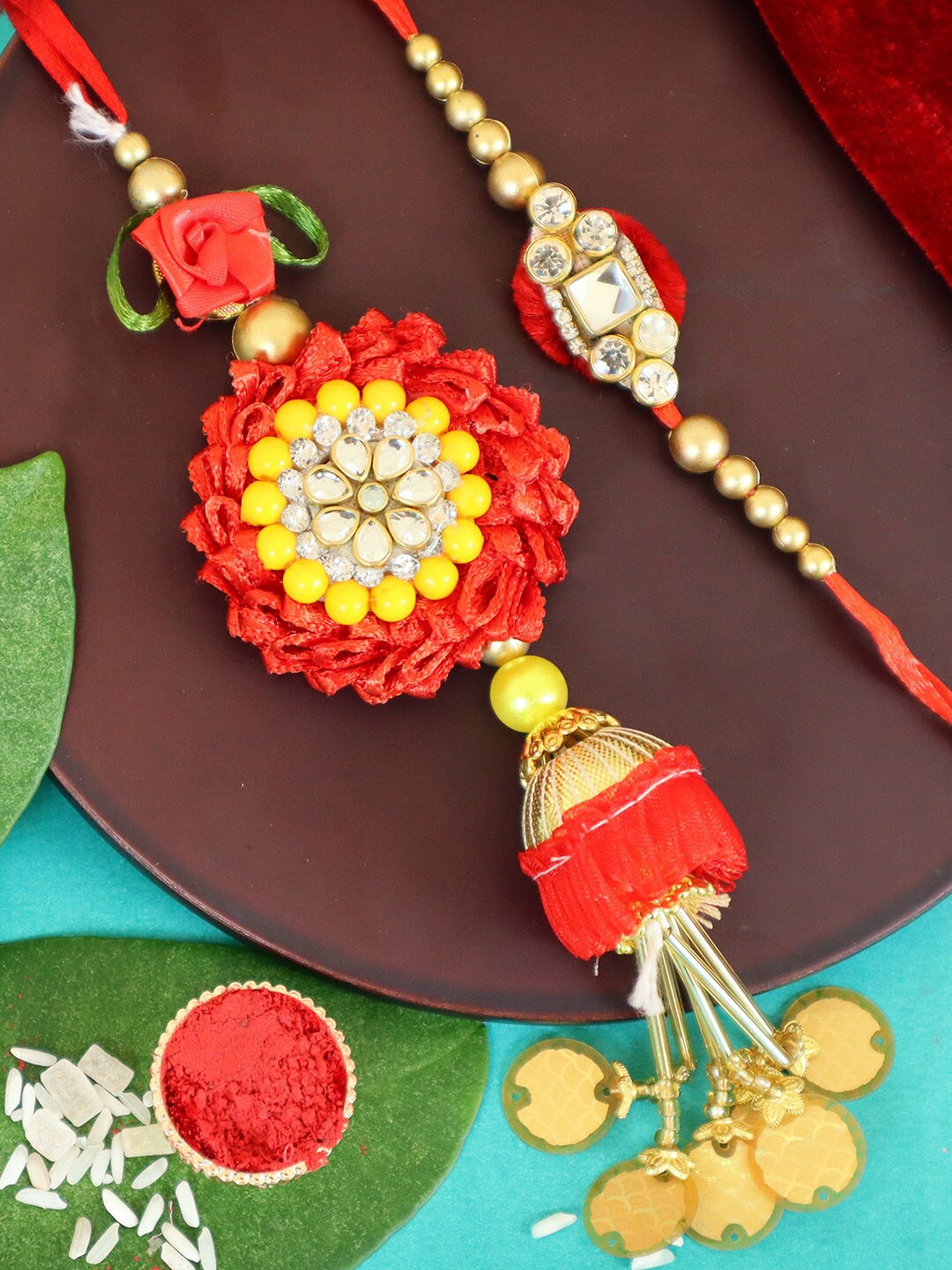 

TIED RIBBONS Maroon Bhaiya Bhabhi Floral Lumba Rakhi with Card & Roli Chawal Gift Set