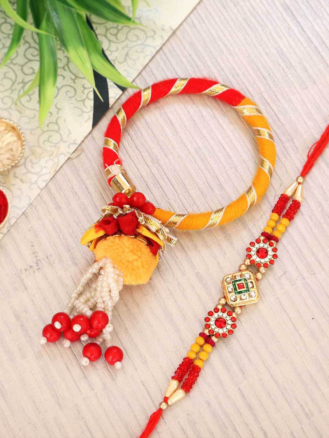 

TIED RIBBONS 2 Orange Designer Bhaiya Bhabhi Lumba Bangle Rakhi with Card & Roli Chawal