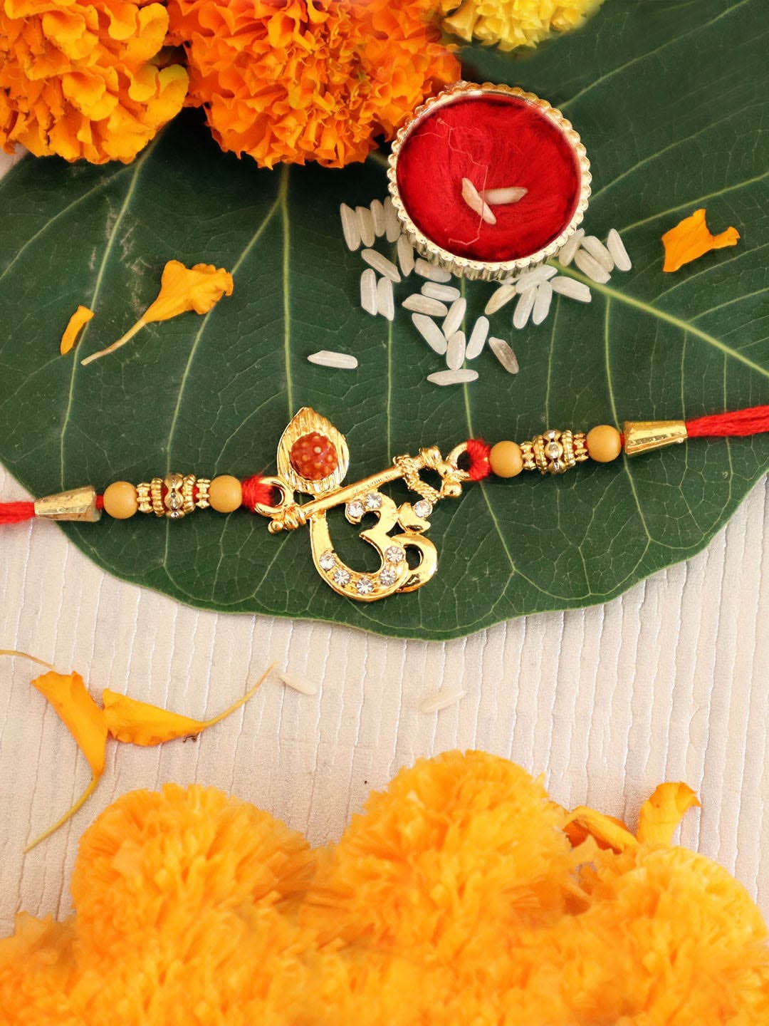 

TIED RIBBONS Designer Rudraksha Om Rakhi with Card & Roli Chawal Combo Gift Pack, Multi