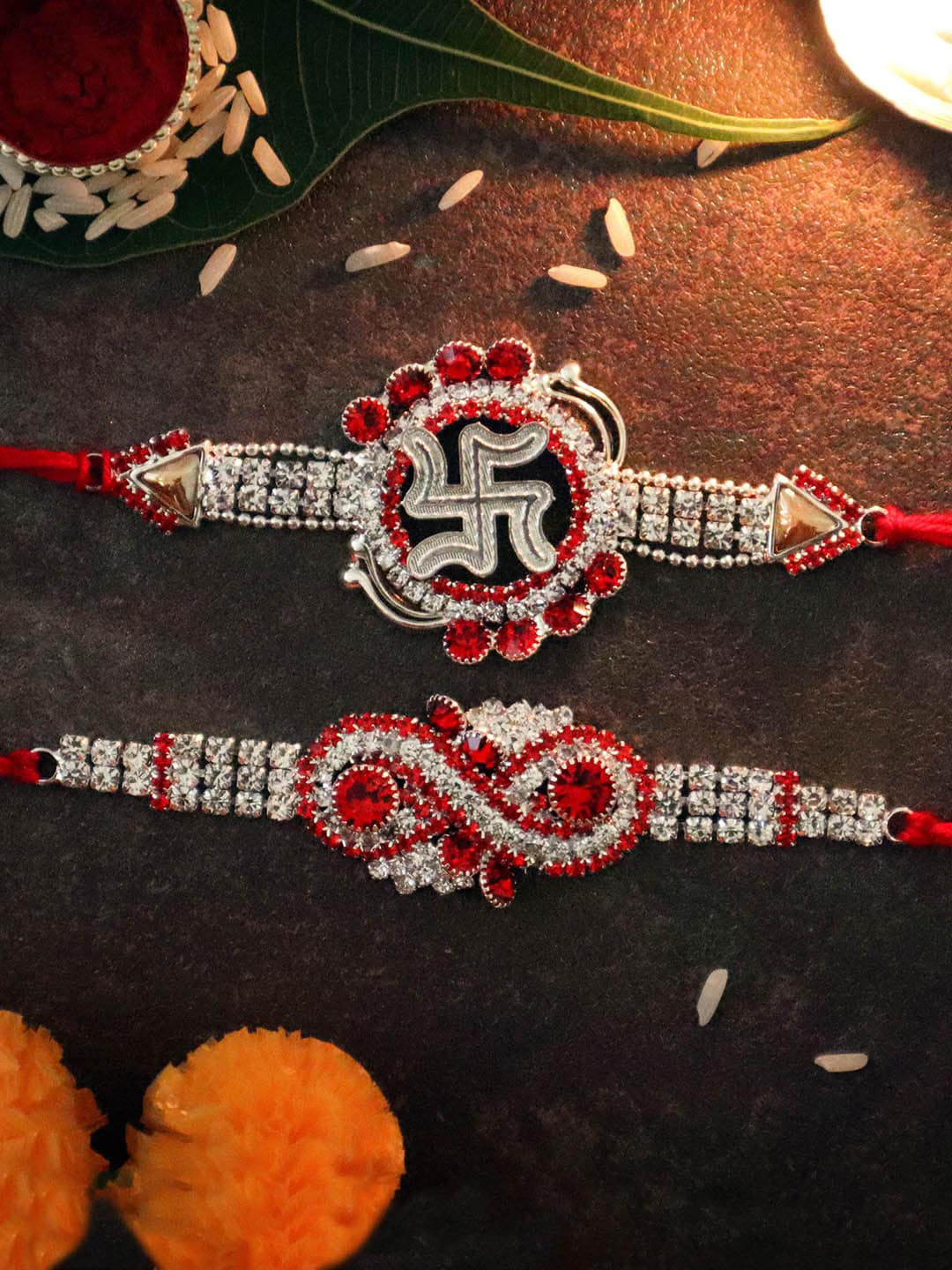 

TIED RIBBONS Set of 2 Stoned-Studded Infinity & Swastik Rakhi with Card & Roli Chawal, Multi