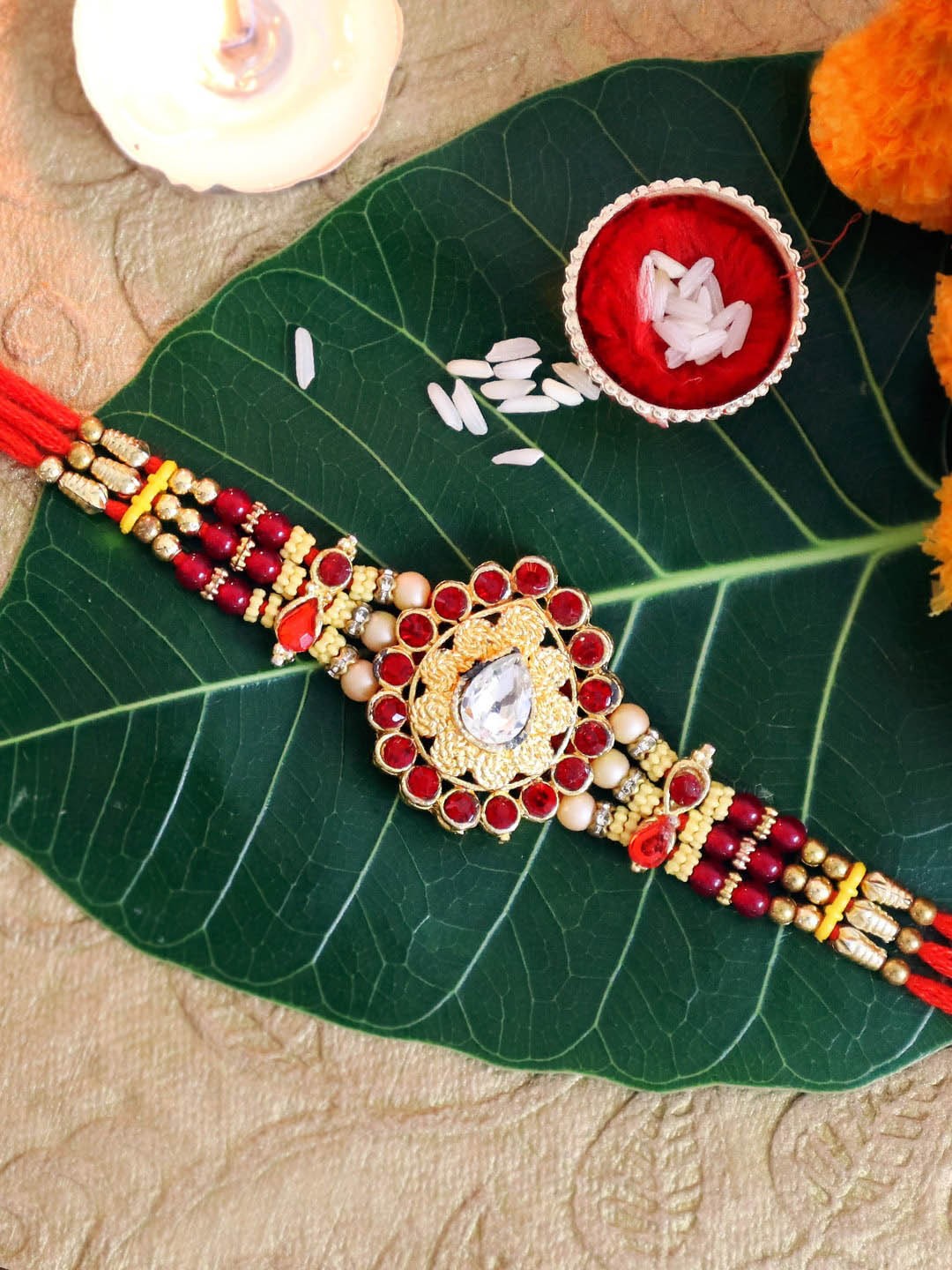 

TIED RIBBONS Red Premium Stoned-Studded Rakhi with Card & Roli Chawal Gift Set