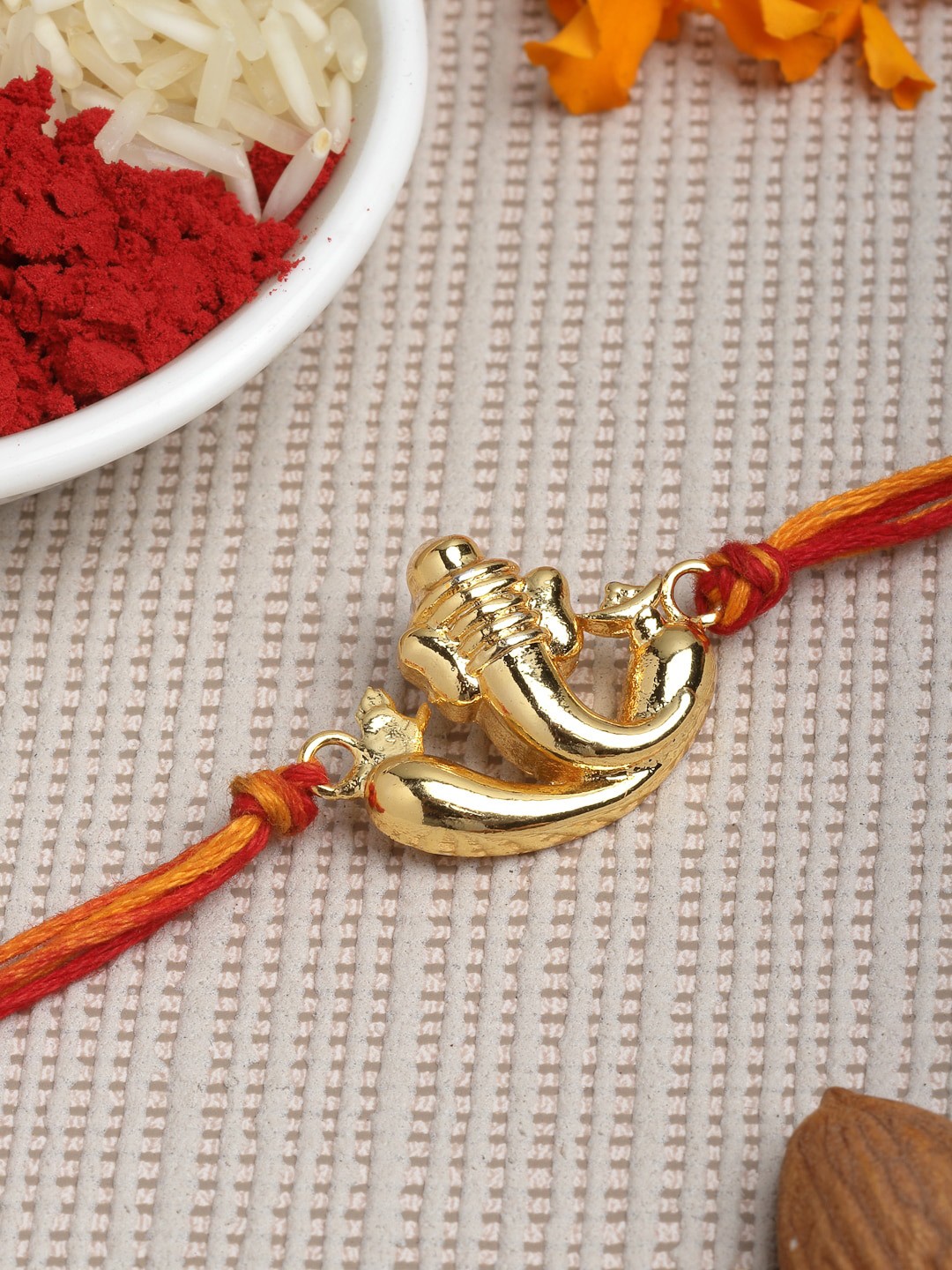 

PANASH Men Gold-Toned & Red God Ganesha Charm Convertible Pendant Rakhi With Roli Chawal