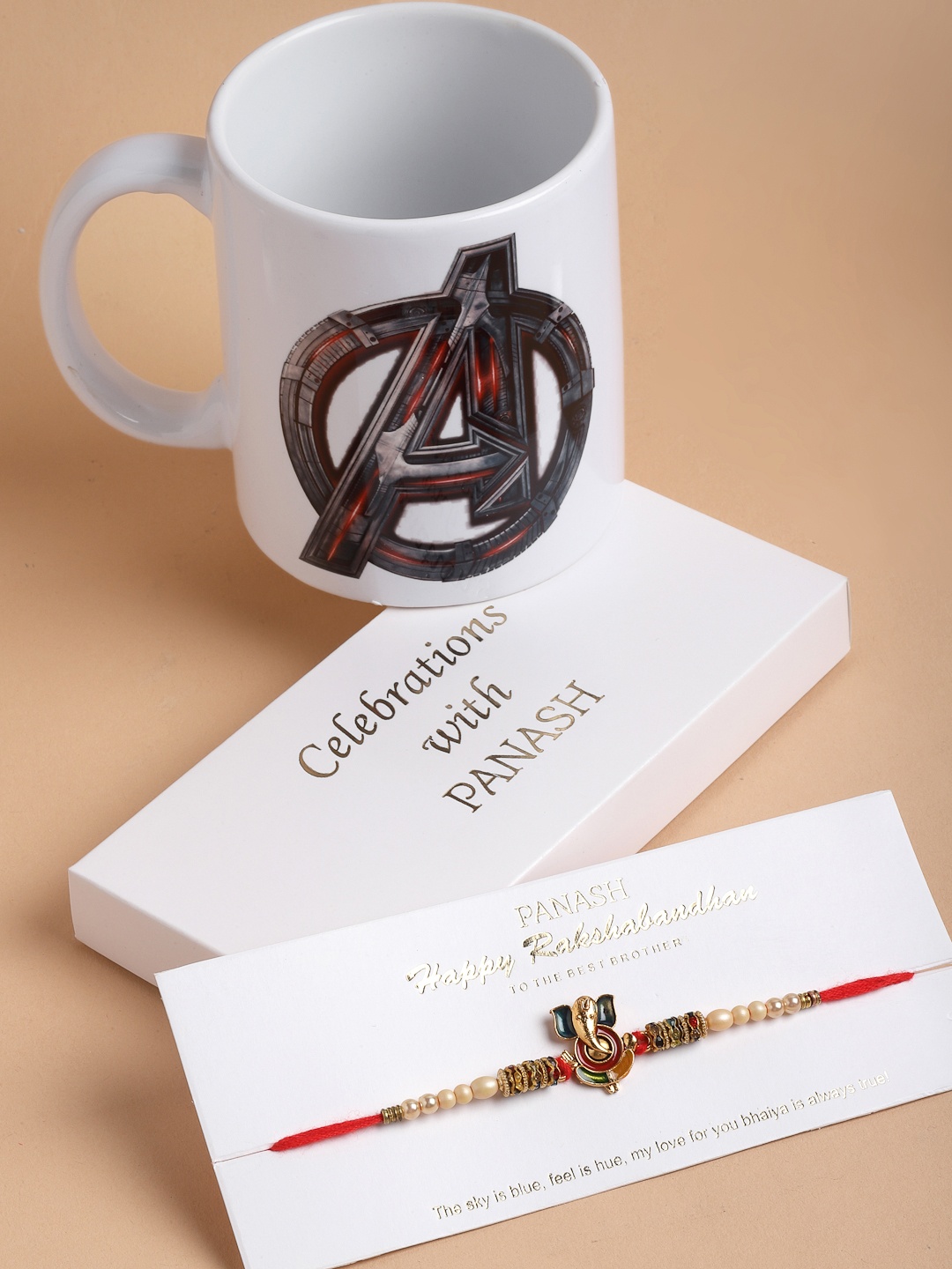 

PANASH Men Gold-Toned Lord Ganesha Pearls Handcrafted Rakhi with Mug Gift Set