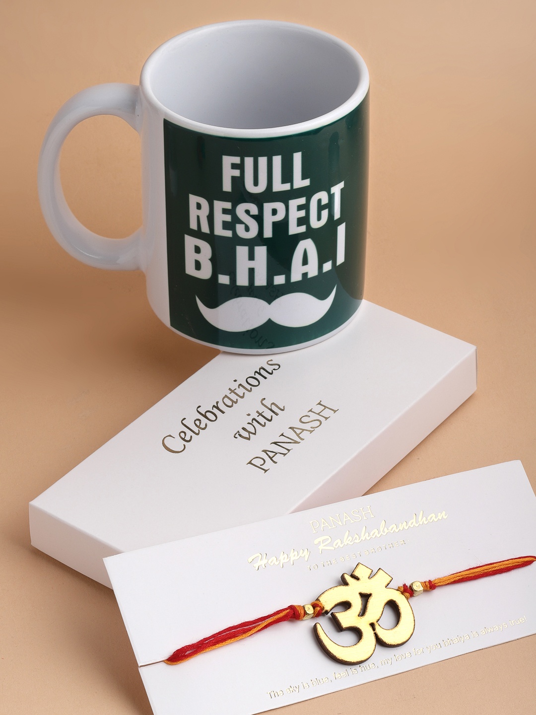 

PANASH Men OM Handcrafted Rakhi with Mug Gift Set, Gold