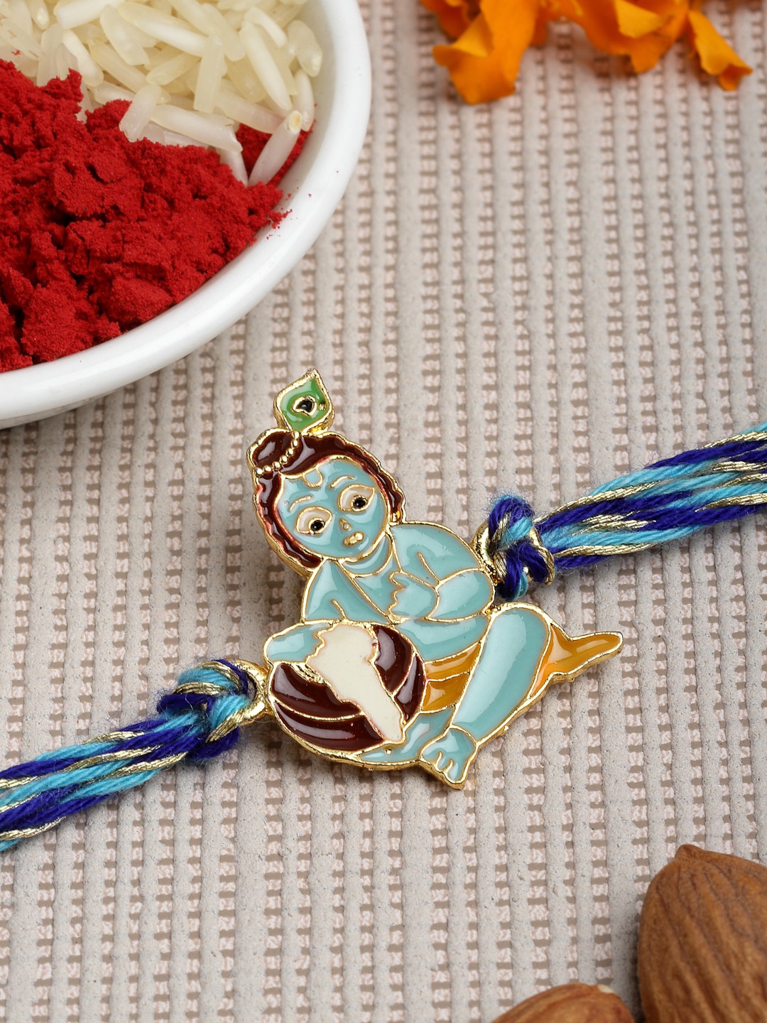

PANASH Men Gold-Toned & Blue Bal Gopal Rakhi With Roli Chawal