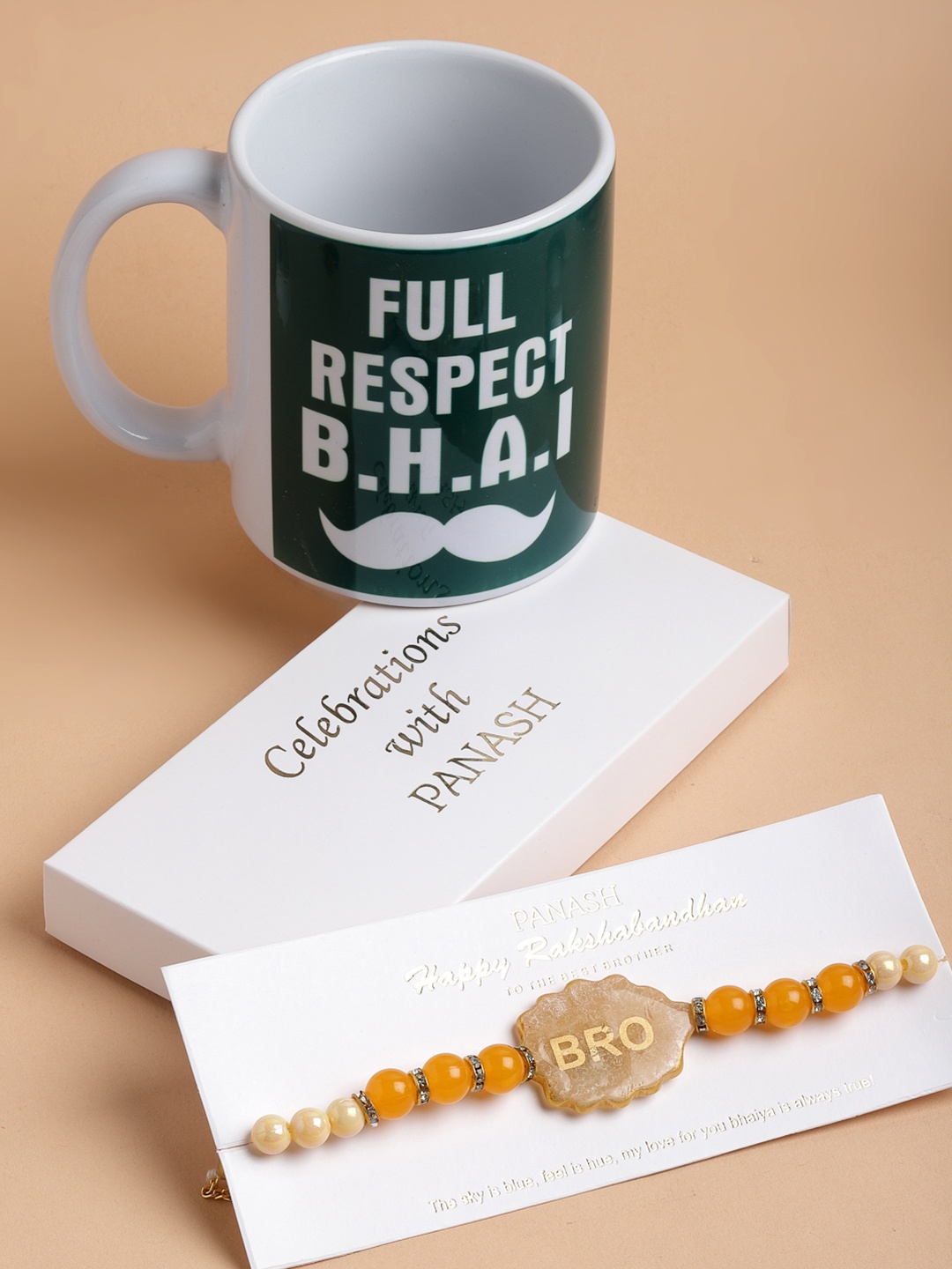 

PANASH Gold-Plated Yellow Pearls Rakhi With Printed Mug Gift Set