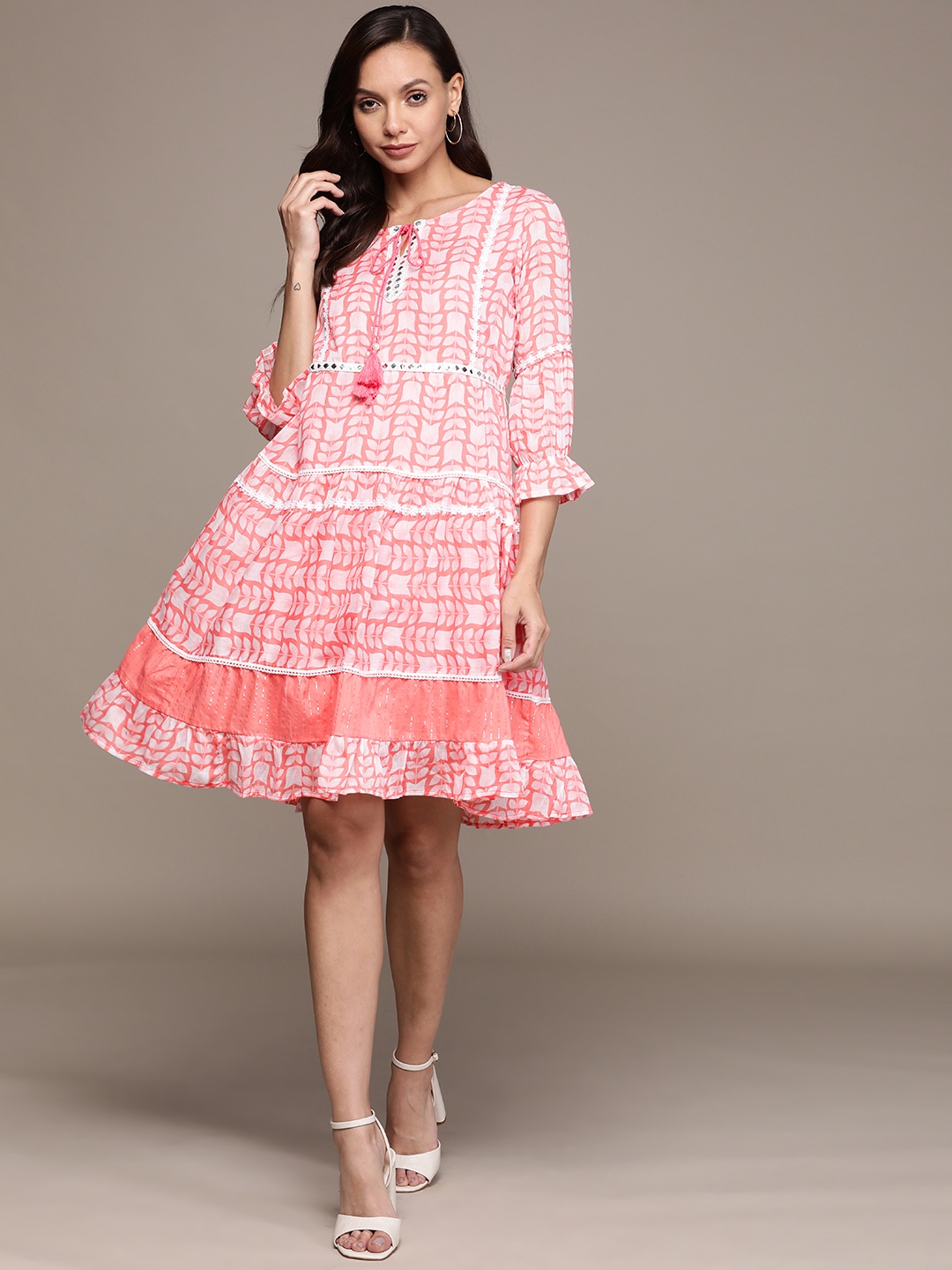

Ishin Coral Pink & White Ethnic Motifs Printed Embellished Tie-Up Neck Cotton A-Line Dress