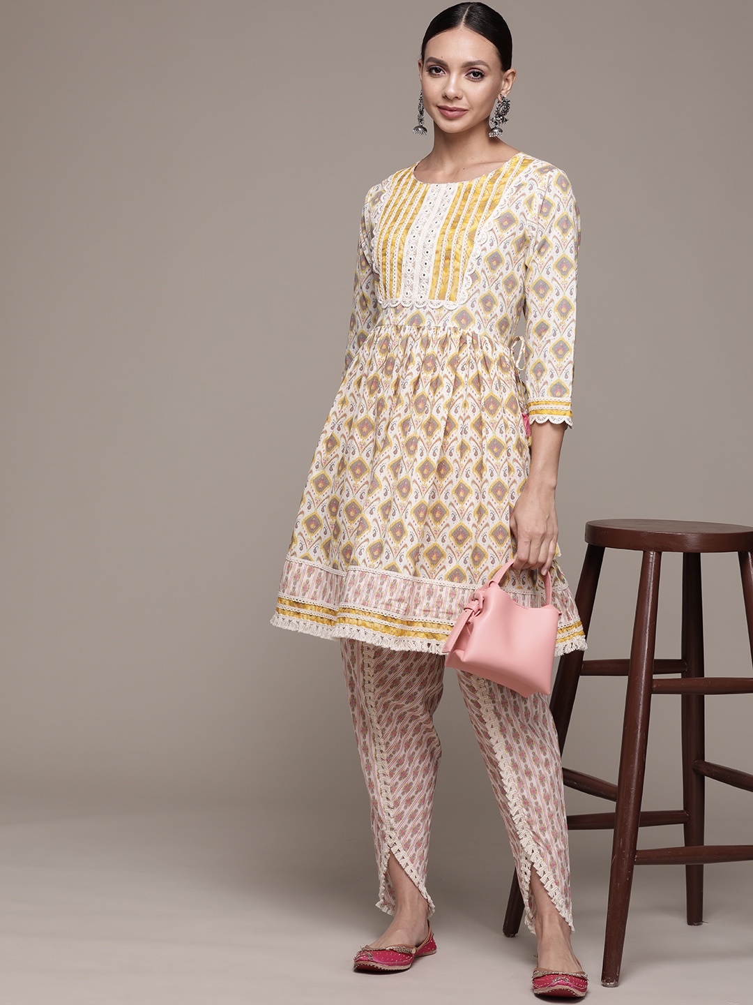 

Ishin Women Yellow Ethnic Motifs Printed Mirror Work Pure Cotton Kurta with Dhoti Pants