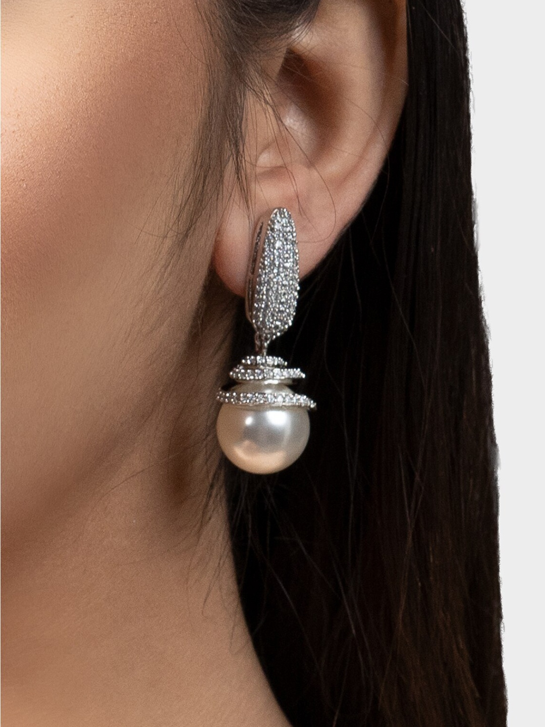 

AURAA TRENDS White Contemporary Jhumkas Earrings