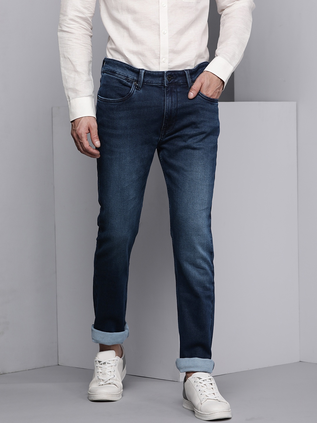 

Kenneth Cole Invictus Men Dark Blue Light Fade Slim Fit Mid Rise Quintessential Jeans
