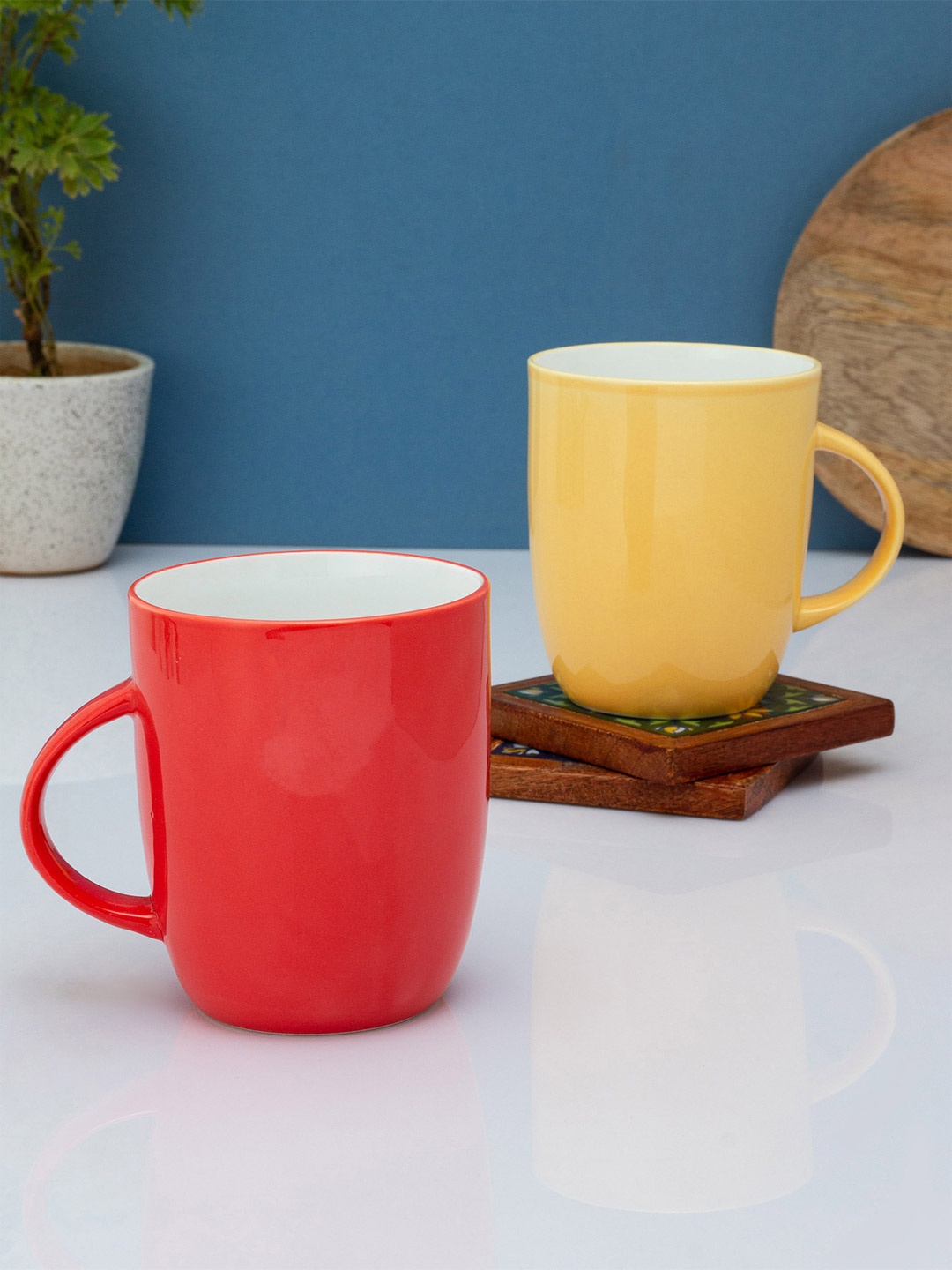 

CLAY CRAFT Red & Yellow Solid Ceramic Glossy Mugs Set of Cups and Mugs