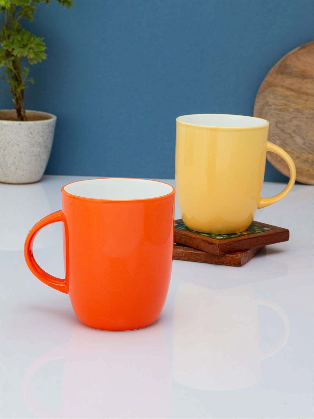 

CLAY CRAFT Red & Yellow Solid Ceramic Glossy Mugs Set of Cups and Mugs