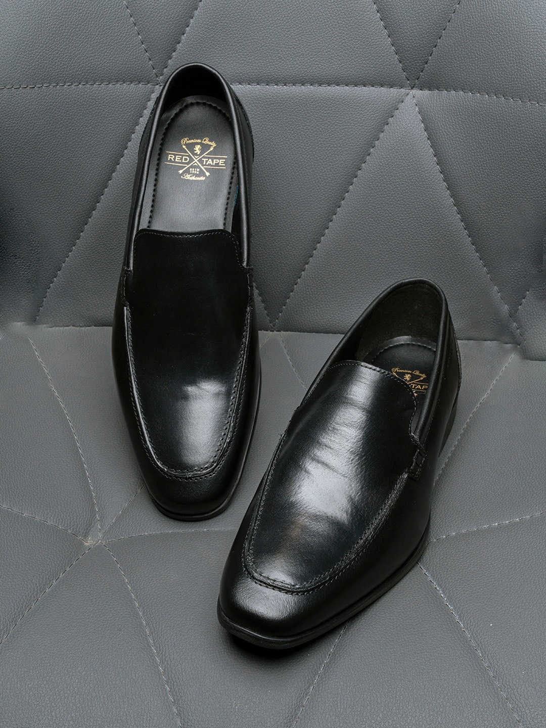 

Red Tape Men Black Solid Leather Formal Slip-on's