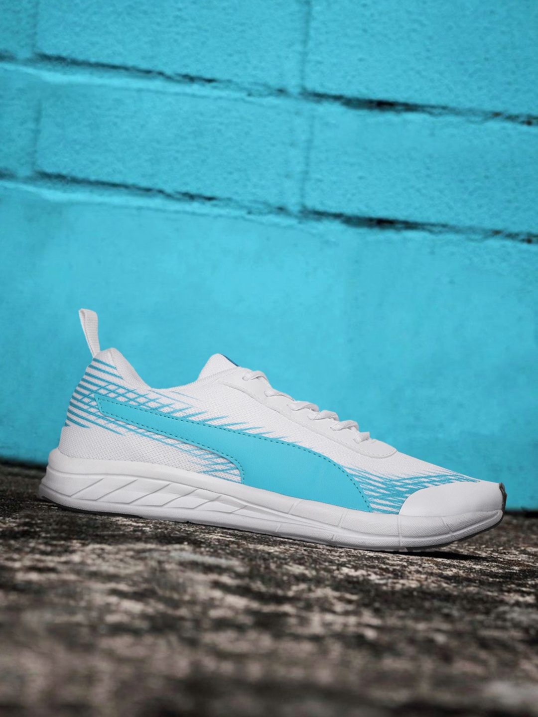 

Puma Men White & Blue Printed Velocity Trn Regular Running Shoes