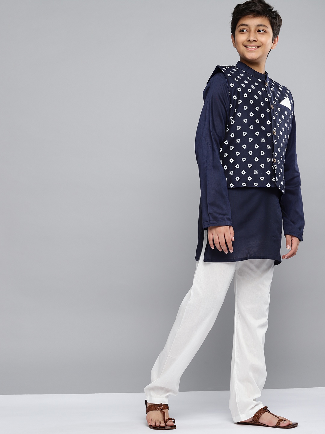 

YK Boys Navy Blue Printed Kurta with White Pyjamas & Nehru Jacket