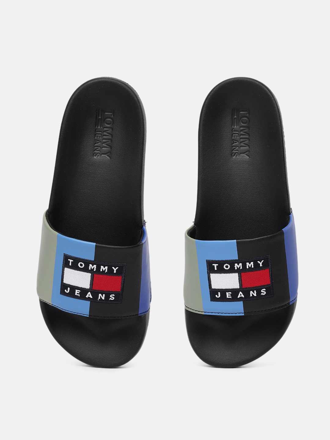 

Tommy Hilfiger Men Blue & Black Colourblocked Sliders