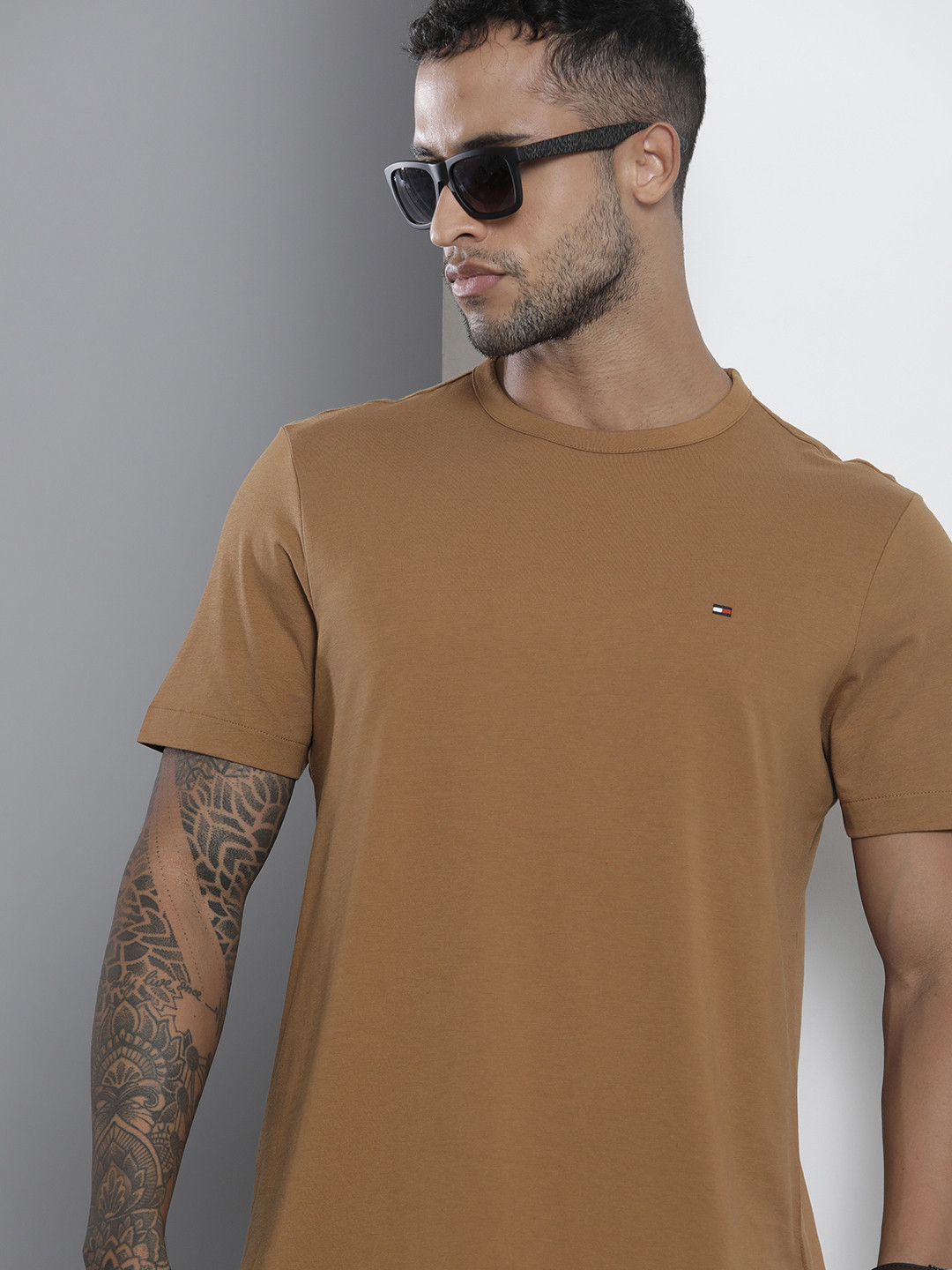 

Tommy Hilfiger Men Beige Solid Round Neck Pure Cotton T-shirt