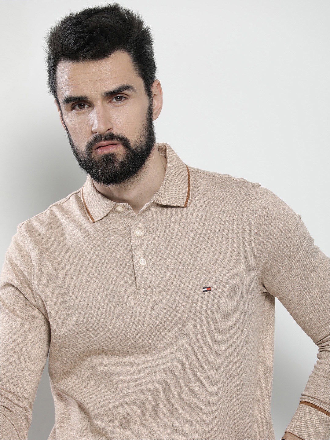 

Tommy Hilfiger Men Beige & Brown Self-Design Slim Fit Polo Collar T-shirt