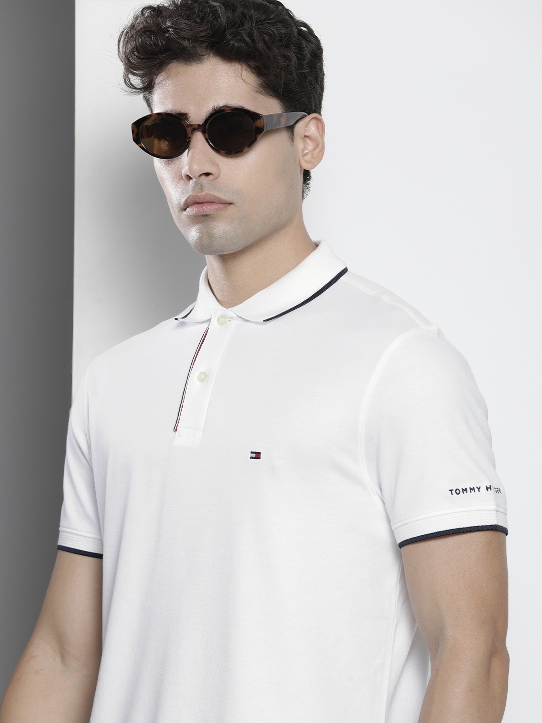 

Tommy Hilfiger Men White Solid Polo Collar Casual T-shirt