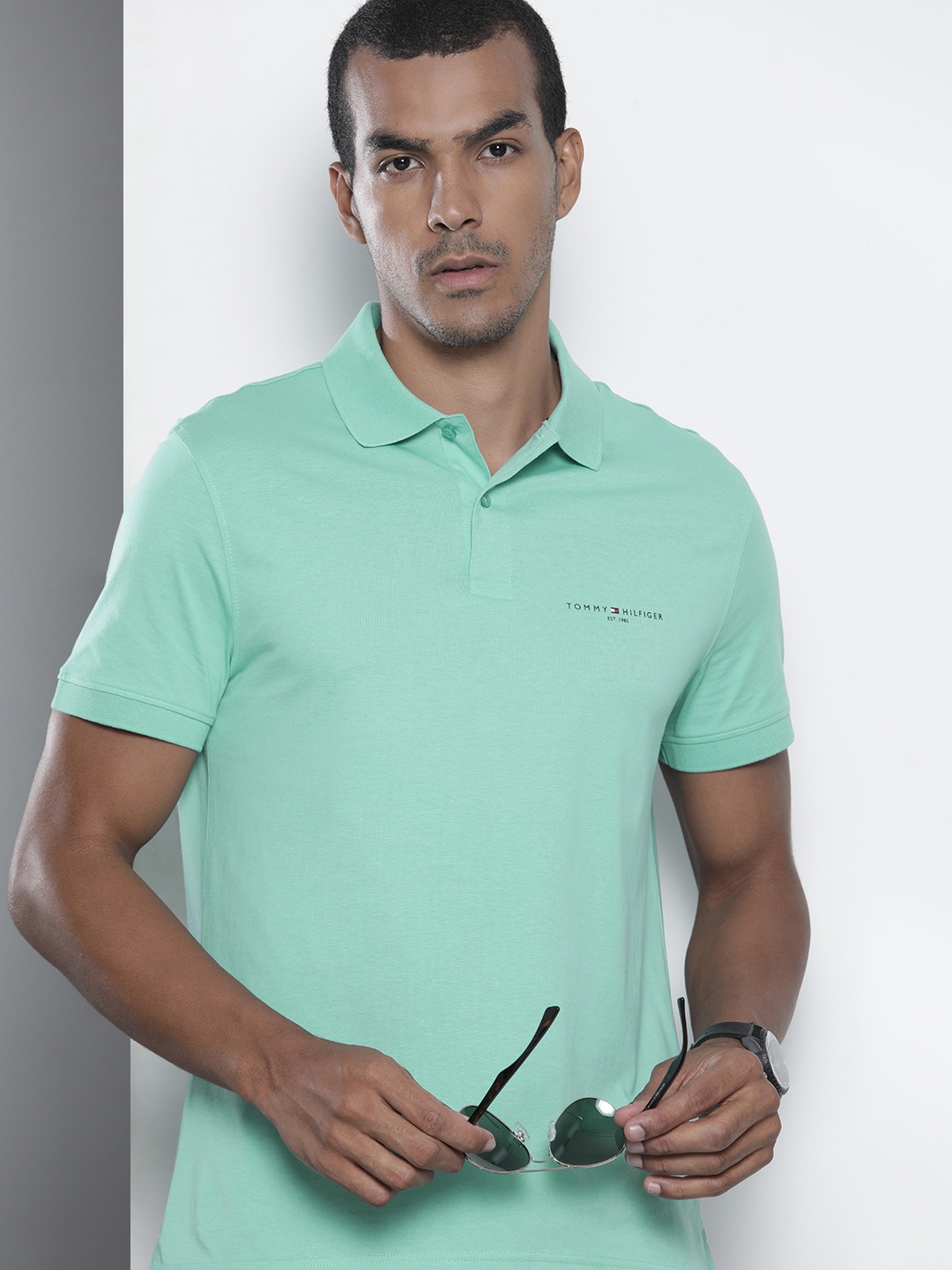 

Tommy Hilfiger Men Sea Green Solid Pure Cotton Polo Collar T-shirt