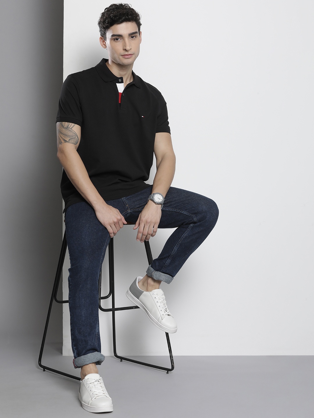 

Tommy Hilfiger Men Black Solid Polo Collar Pure Cotton Casual T-shirt