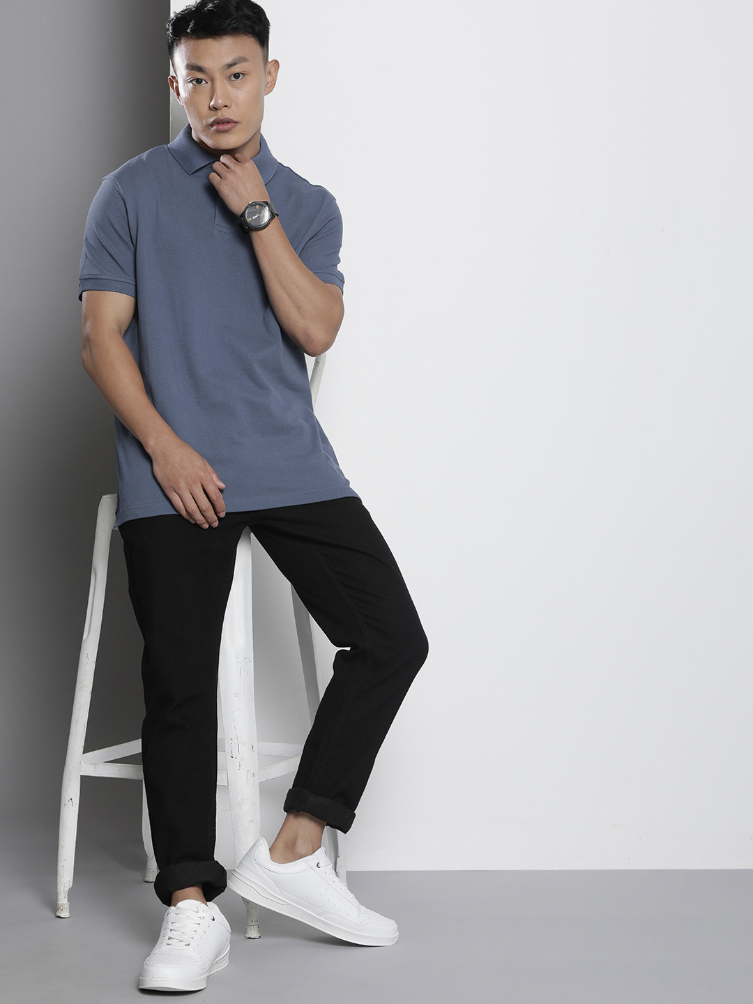 

Tommy Hilfiger Men Blue Solid Polo Collar Casual T-shirt