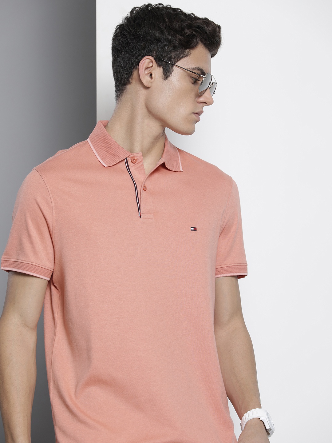 

Tommy Hilfiger Men Peach-Coloured Solid Polo Collar Casual T-shirt
