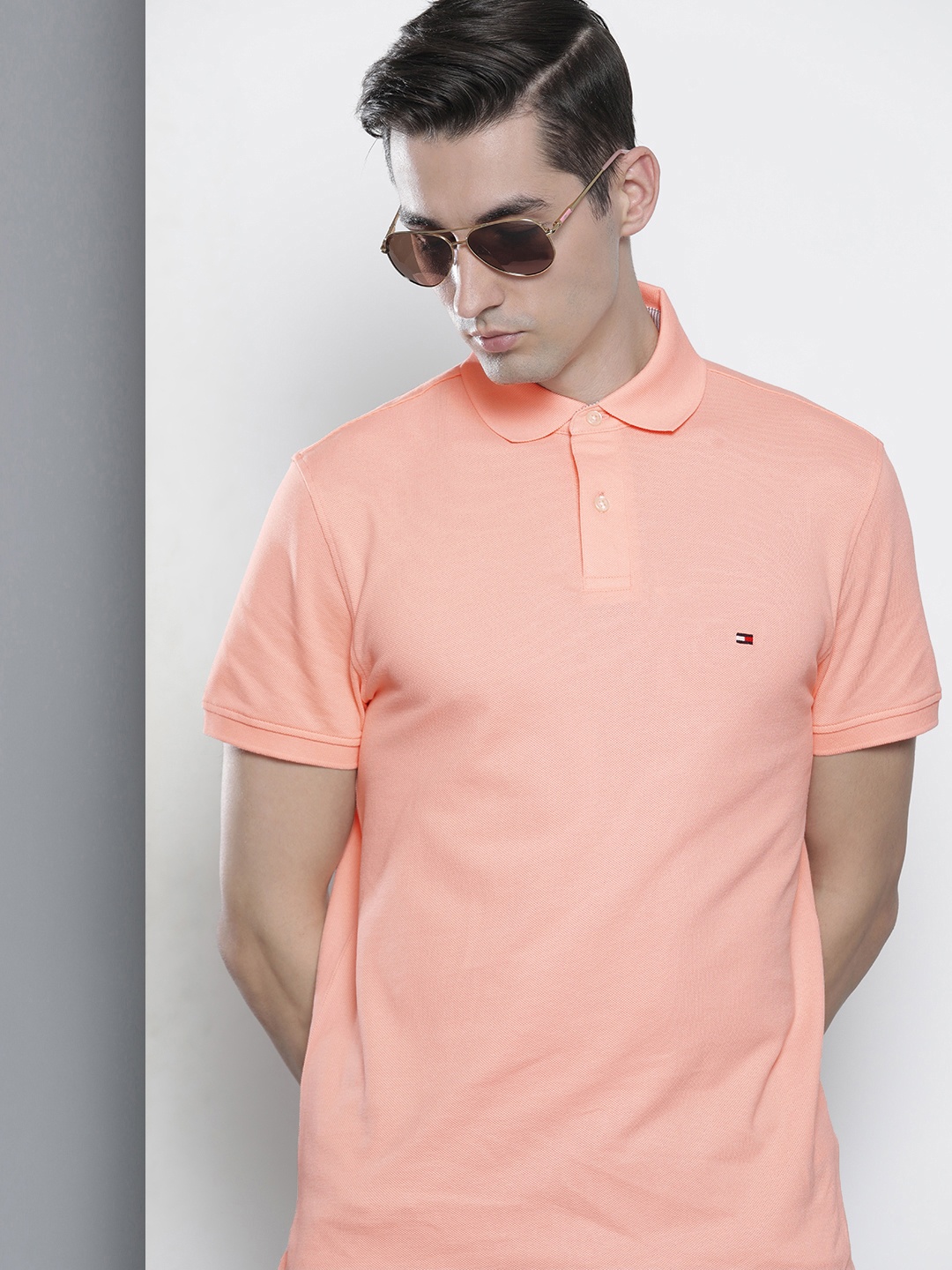 

Tommy Hilfiger Men Orange Brand Logo Printed Polo Collar T-shirt