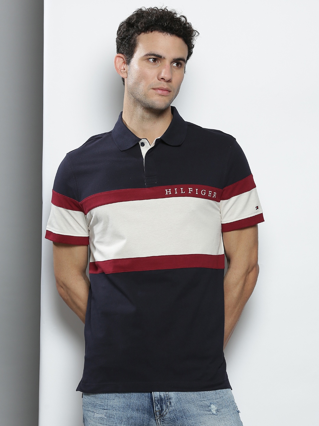 

Tommy Hilfiger Men Navy Blue & White Colourblocked Cotton Polo Collar T-shirt