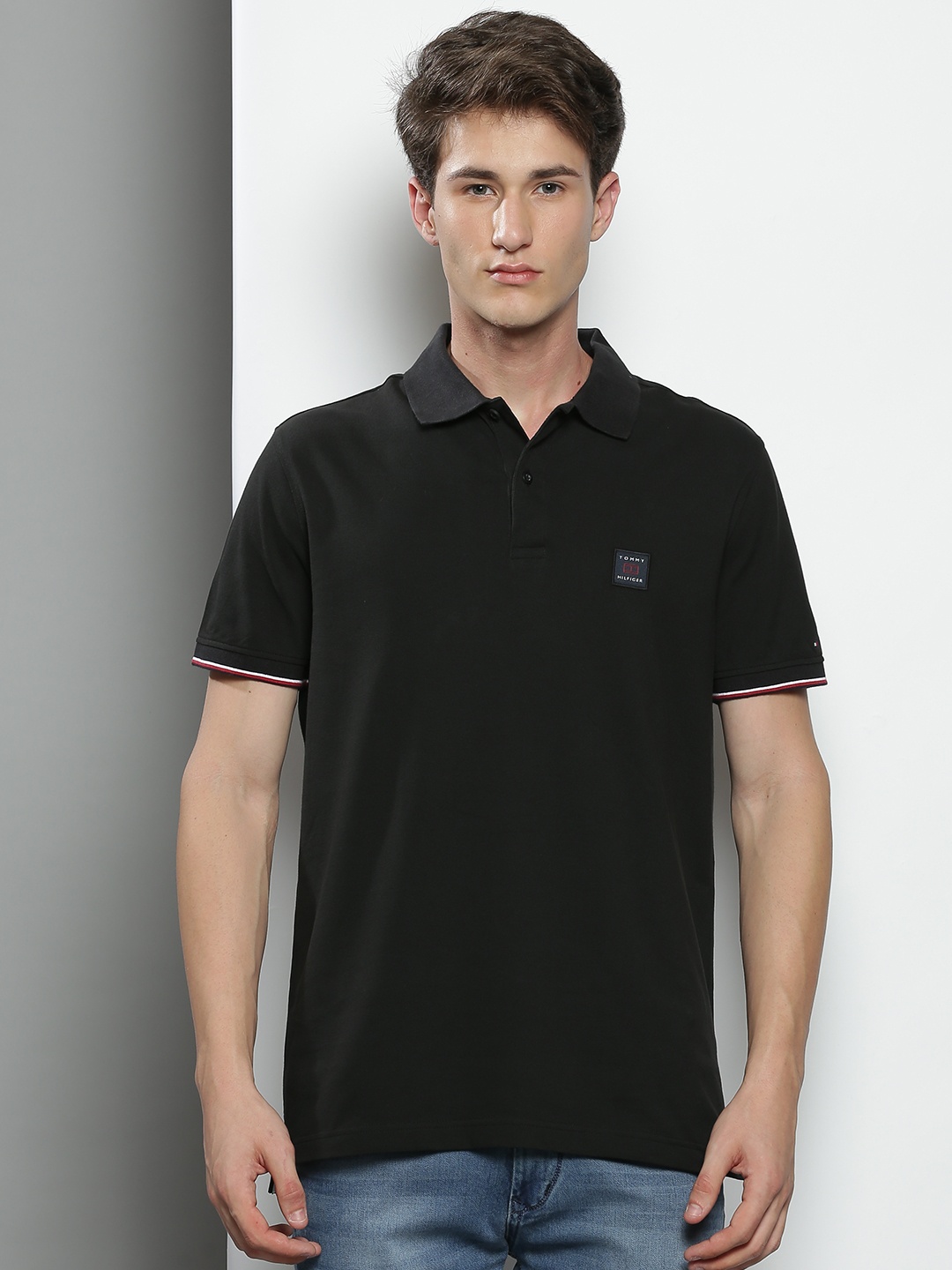 

Tommy Hilfiger Men Black Solid Polo Collar Cotton T-shirt