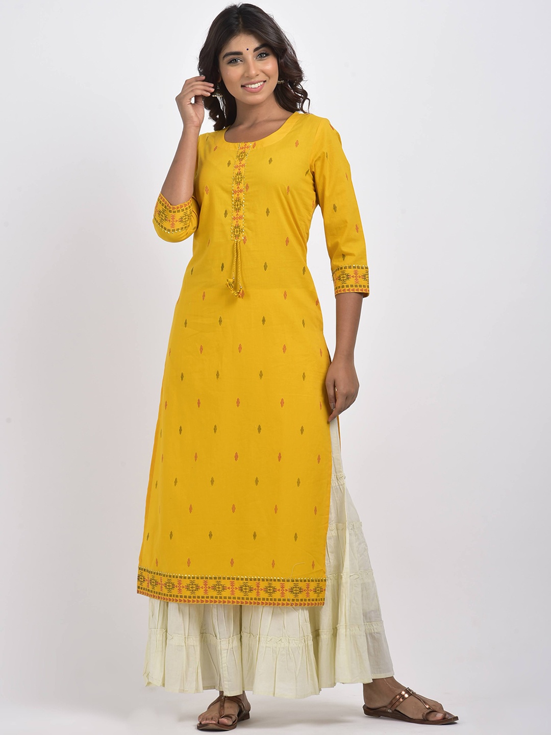 

Swasti Women Yellow Geometric Embroidered Mirror Work Floral Kurta