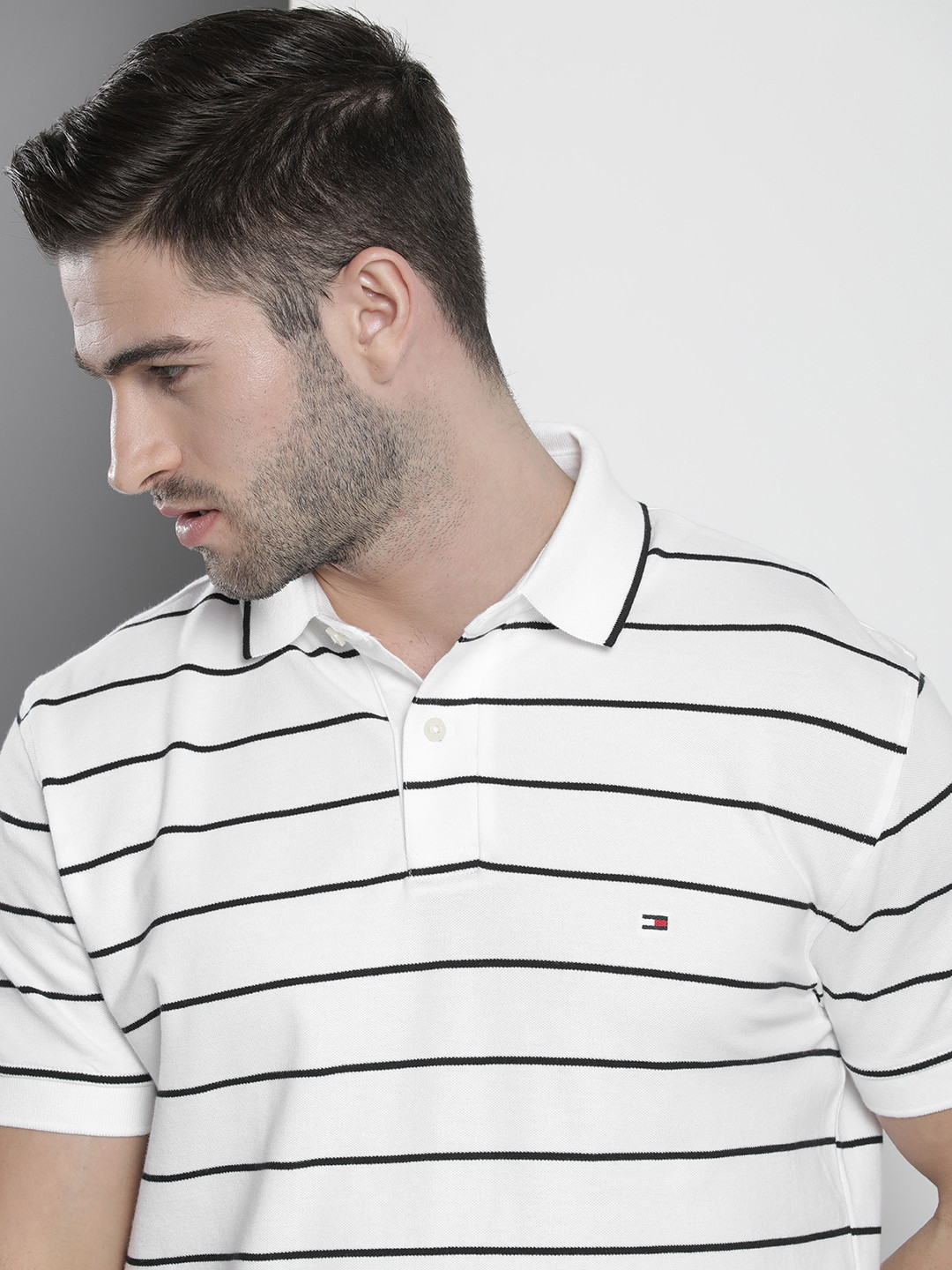 

Tommy Hilfiger Men White & Black Striped Polo Collar T-shirt