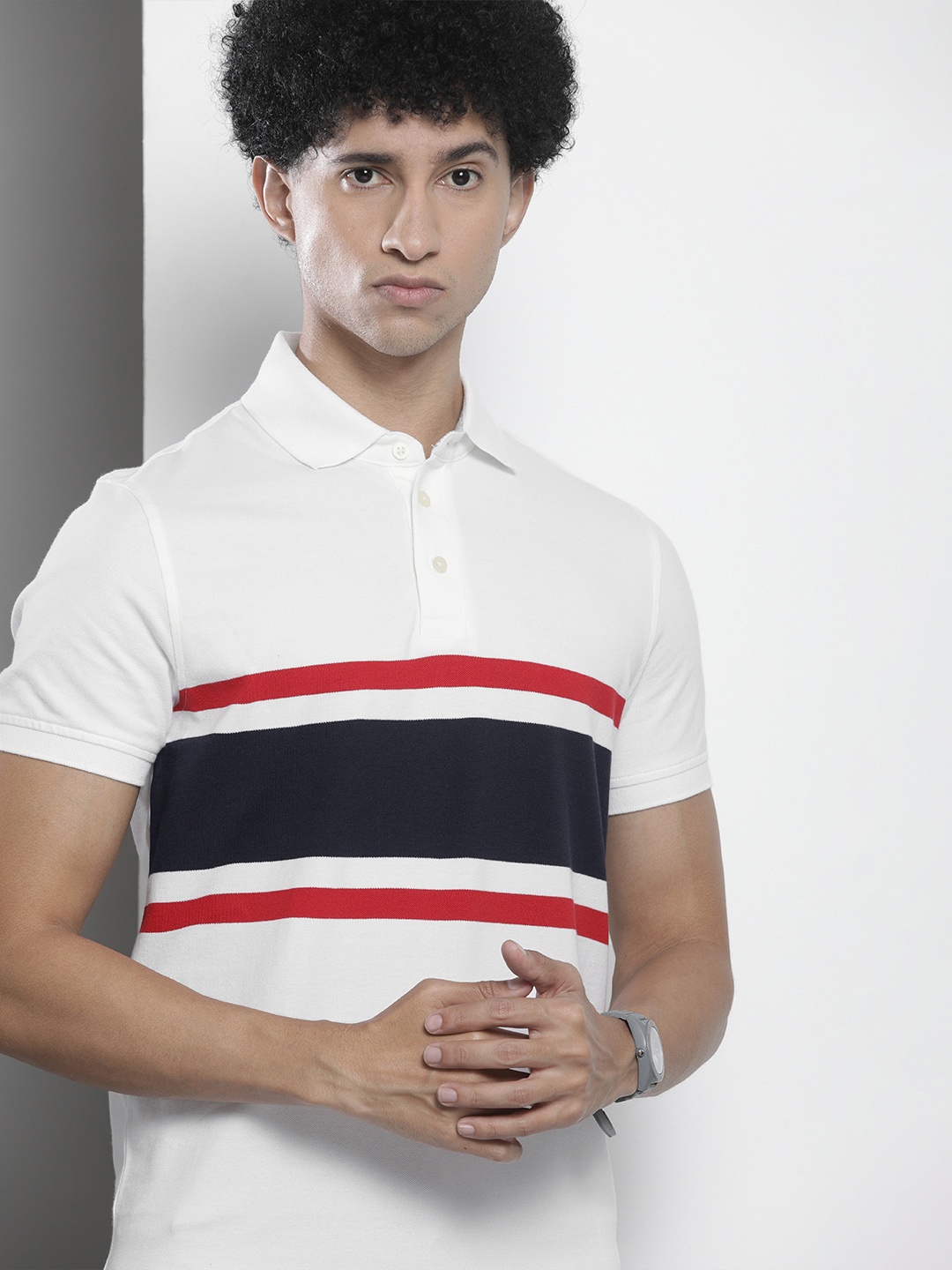 

Tommy Hilfiger Men White & Navy Blue Striped Polo Collar Slim Fit T-shirt