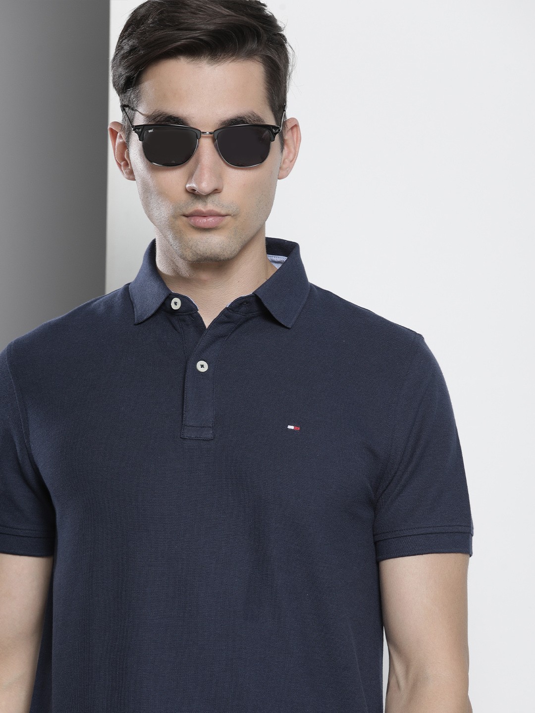 

Tommy Hilfiger Men Navy Blue Solid Polo Collar Casual T-shirt