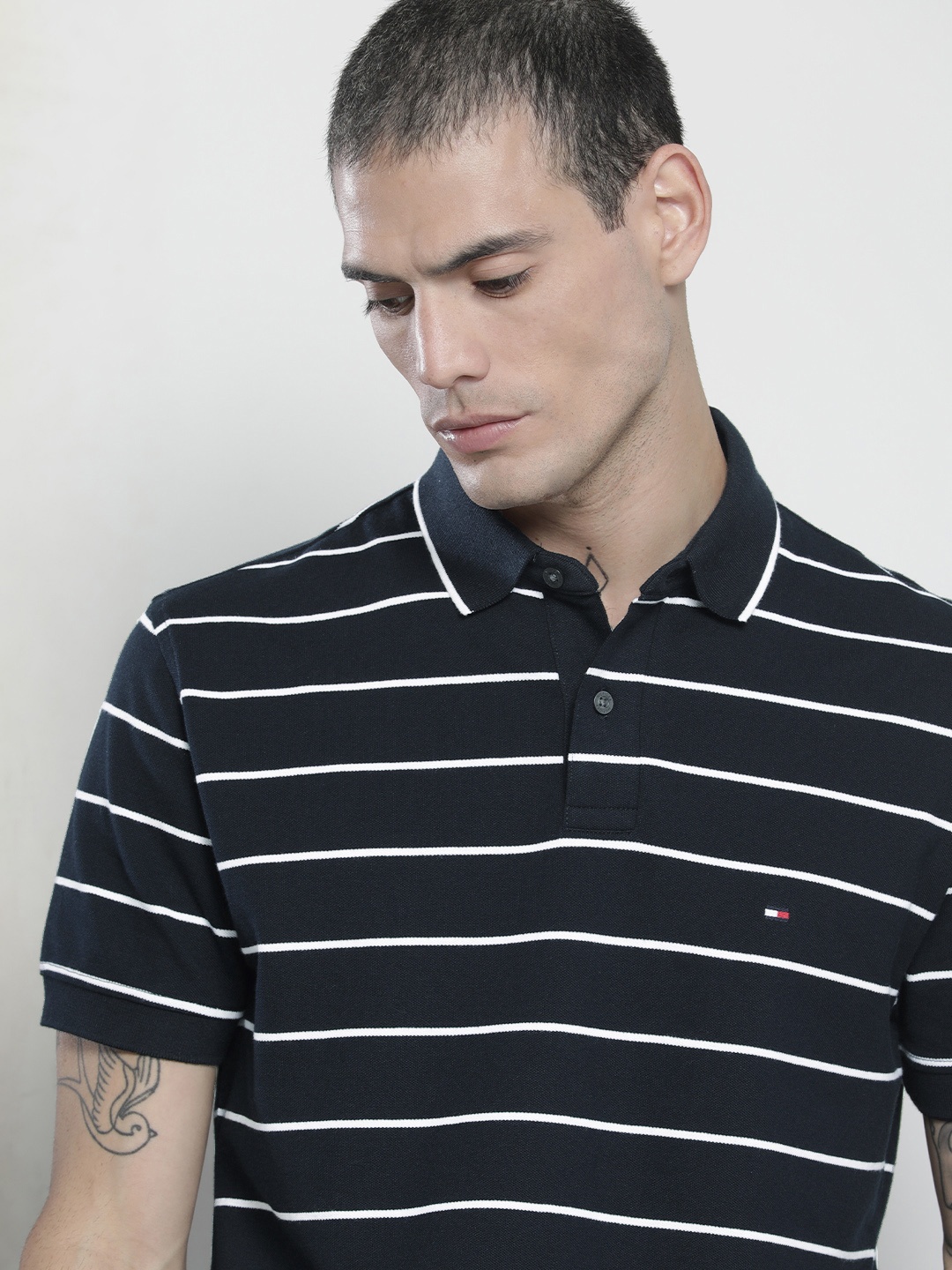 

Tommy Hilfiger Men Navy Blue & White Striped Polo Collar T-shirt