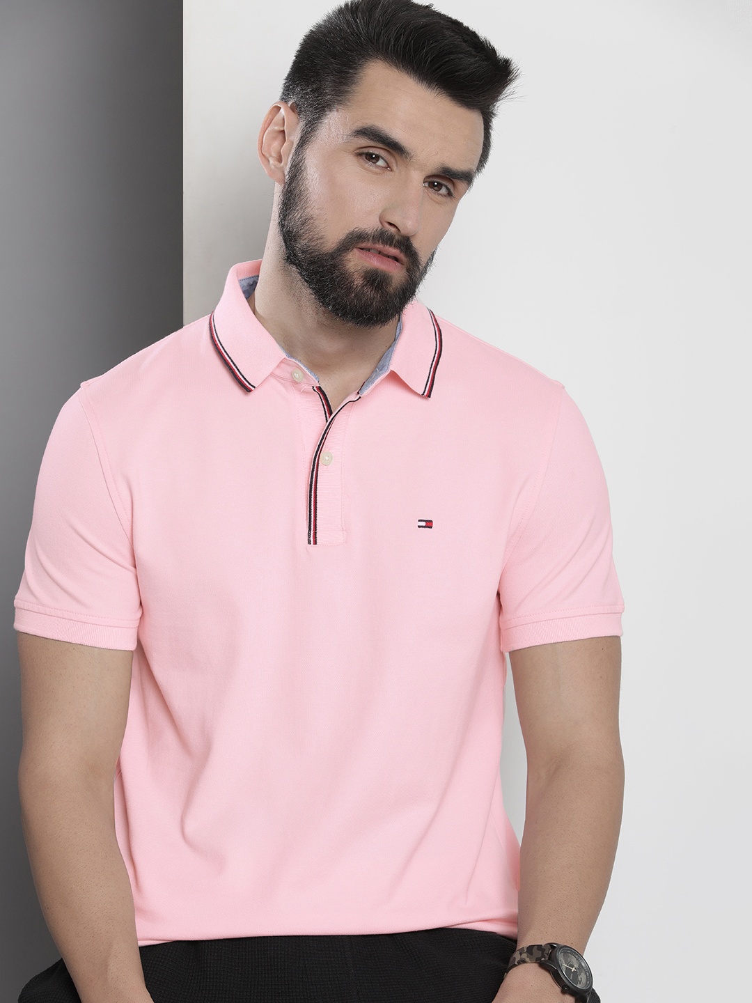 

Tommy Hilfiger Men Pink Solid Polo Collar Casual T-shirt