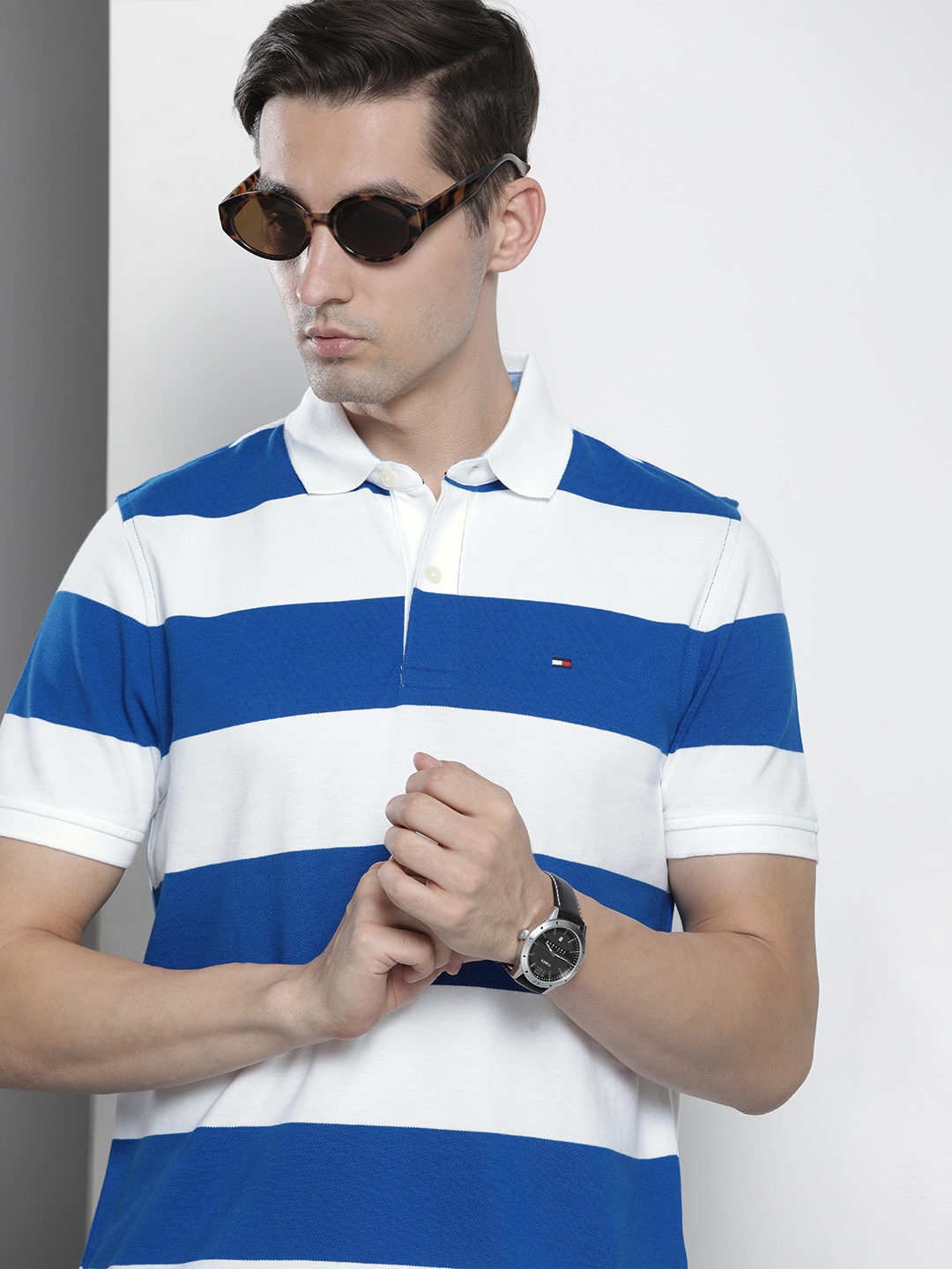 

Tommy Hilfiger Men Blue & White Colourblocked Polo Collar T-shirt