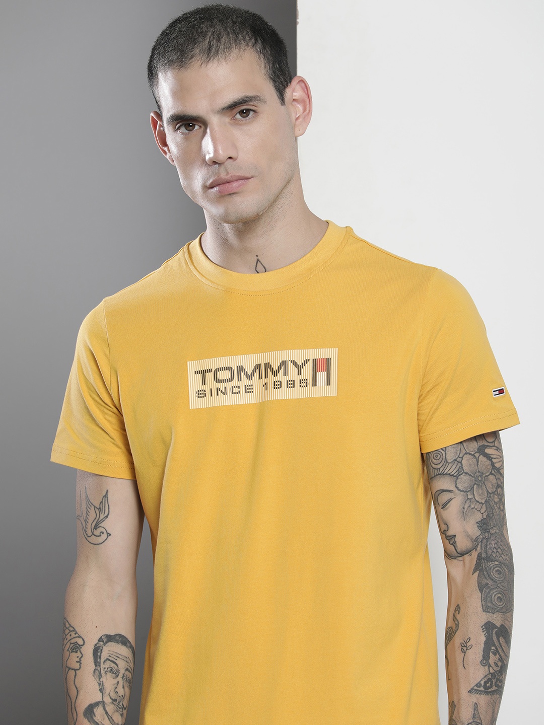 

Tommy Hilfiger Men Mustard Yellow Brand Logo Printed Slim Fit T-shirt